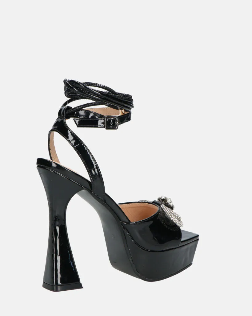 JANINE - tacchi alti con platform in glassy nero e fiocco con gemme